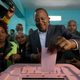epa06131543 Kenya?s incumbent President and the leader of the ruling Jubilee coalition, Uhuru Kenyatta (C), casts his ballot at a polling station in his traditional home, Gatundu, some 60km north of the capital Nairobi, Kenya, 08 August 2017. Kenyans are casting their votes to elect their leaders in general elections where Kenyatta is being challenged by the popular opposition leader Raila Odinga who leads The National Super Alliance (NASA) coalition. Many fear the possibility of post-election violence.